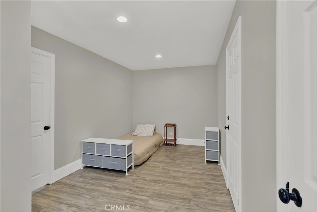 27112 Mill Pond Road, Unit 2 Dana Point, CA 92624 - Photo 14 of 50 a room with a bed and a view of bathroom