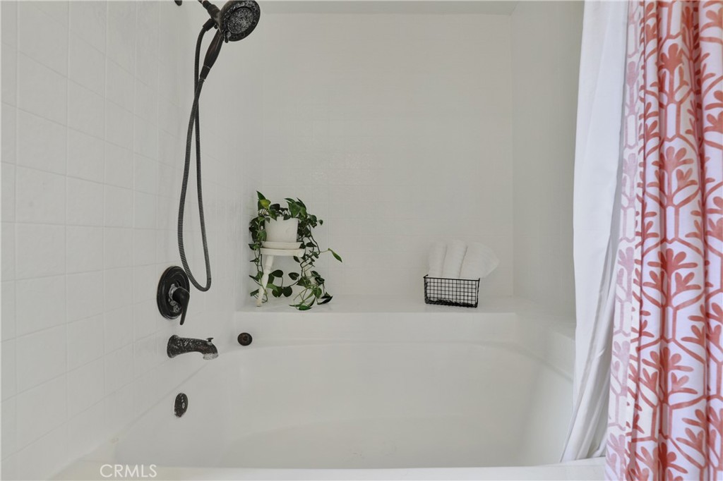 27112 Mill Pond Road, Unit 2 Dana Point, CA 92624 - Photo 25 of 50 a bathroom with a bathtub and shower