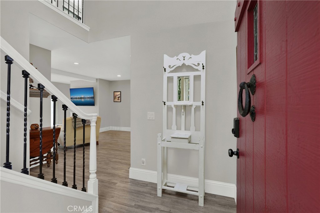 27112 Mill Pond Road, Unit 2 Dana Point, CA 92624 - Photo 3 of 50 a view of entryway with wooden floor and stairs
