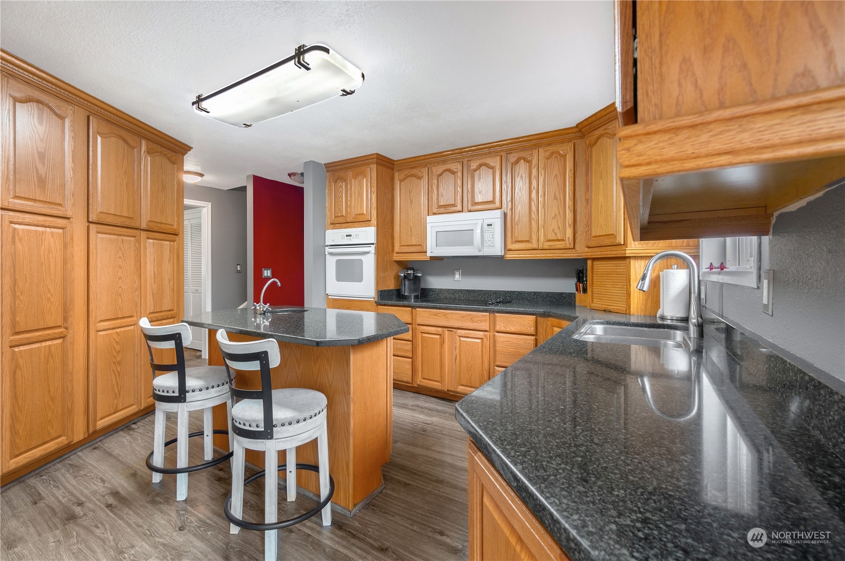 2712 Seminary Hill Road Centralia, WA 98531 - Photo 12 of 40 a kitchen with granite countertop lots of counter top space and furniture
