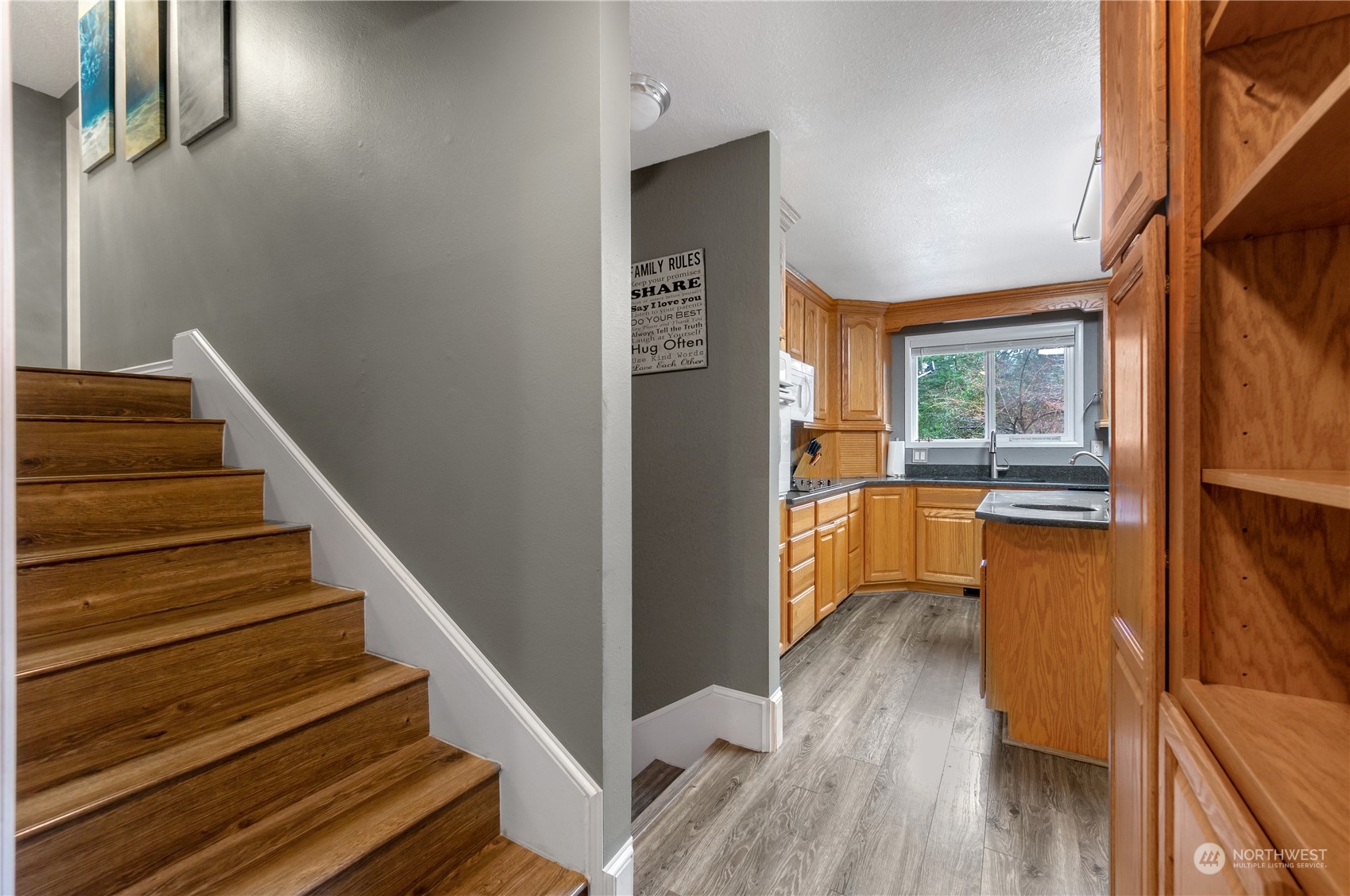 2712 Seminary Hill Road Centralia, WA 98531 - Photo 16 of 40 a view of a kitchen with wooden floor and electronic appliances