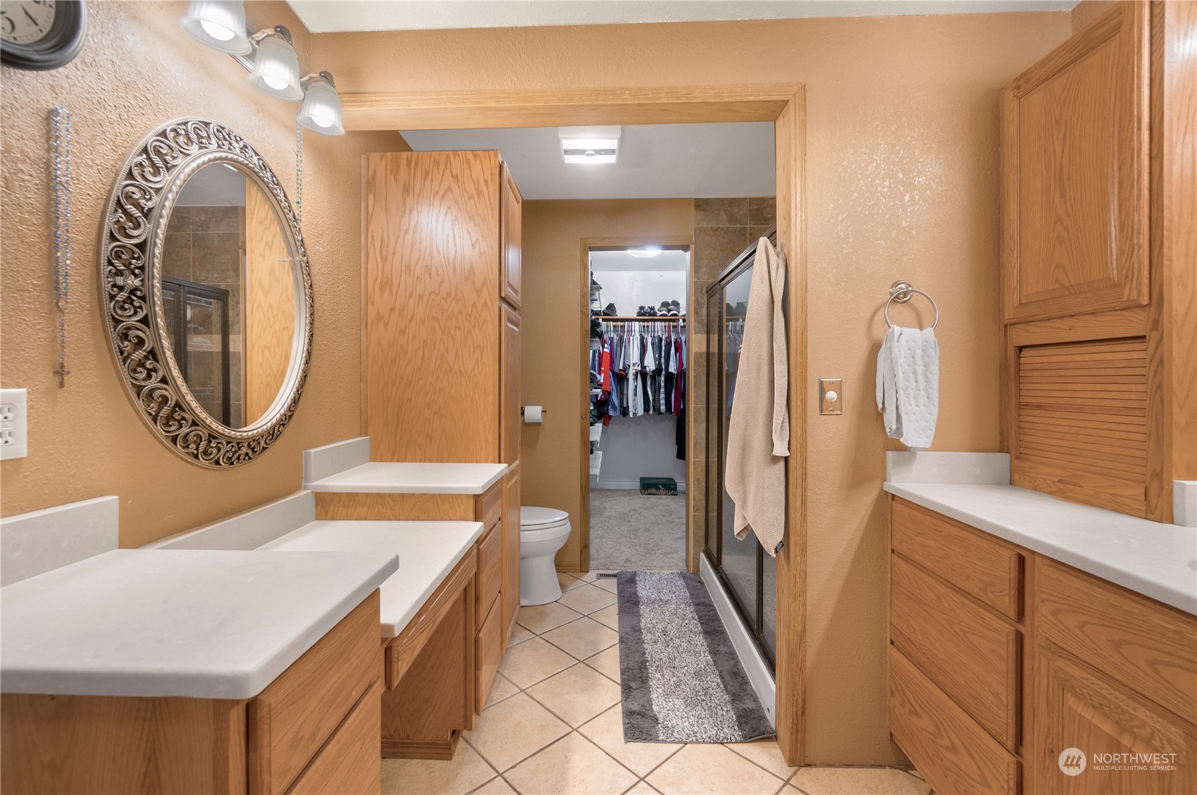 2712 Seminary Hill Road Centralia, WA 98531 - Photo 20 of 40 a bathroom with a sink a mirror and a shower