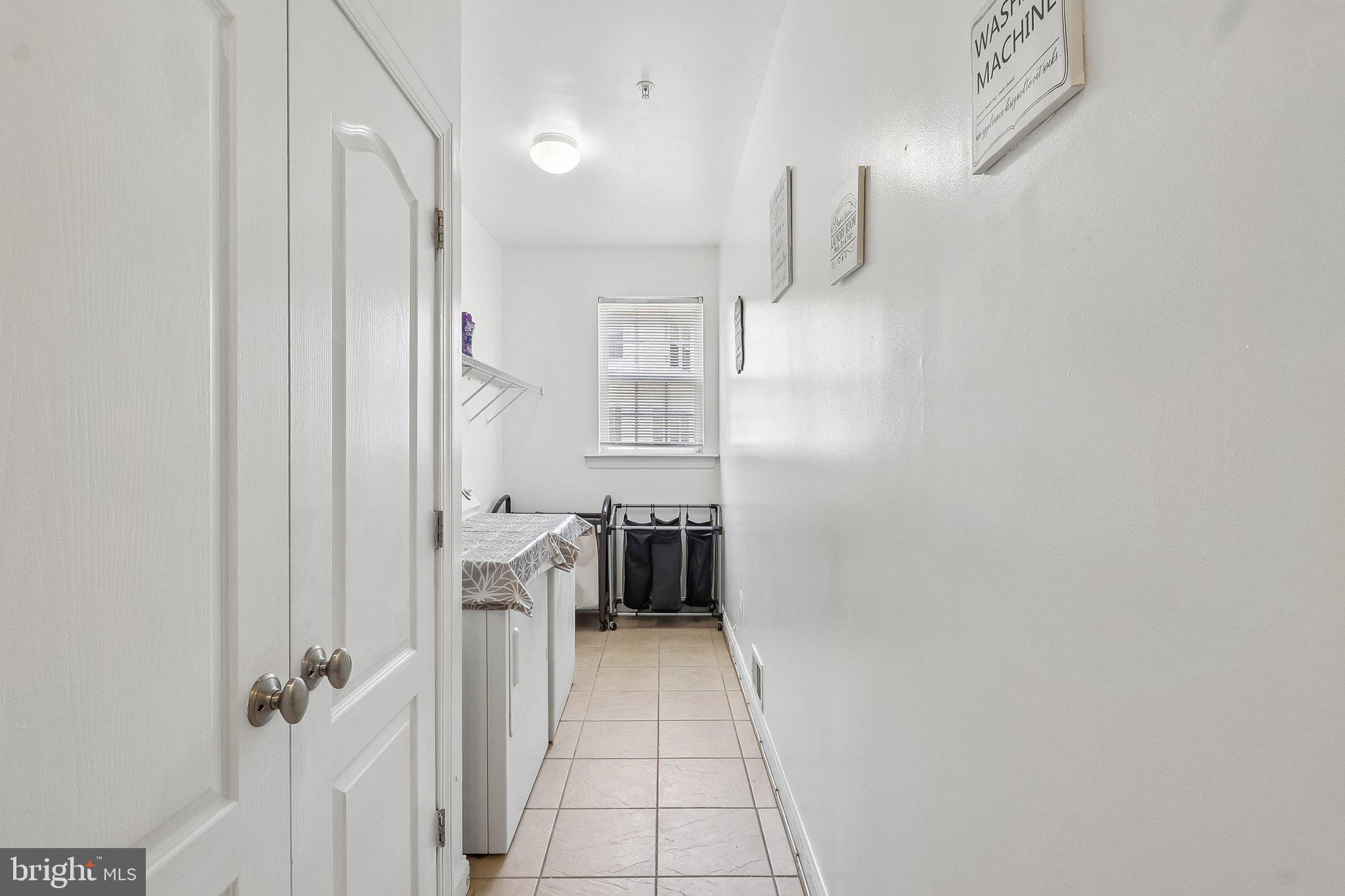 9003 Eldon Drive Clinton, MD 20735 - Photo 36 of 54 Bright and airy laundry space.