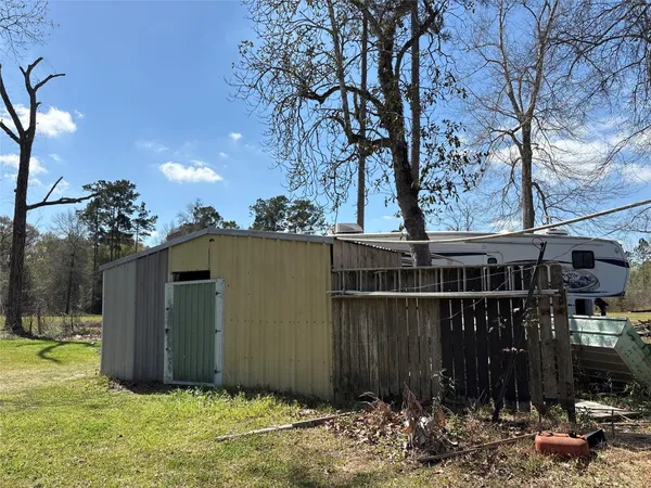 a view of a park with large trees