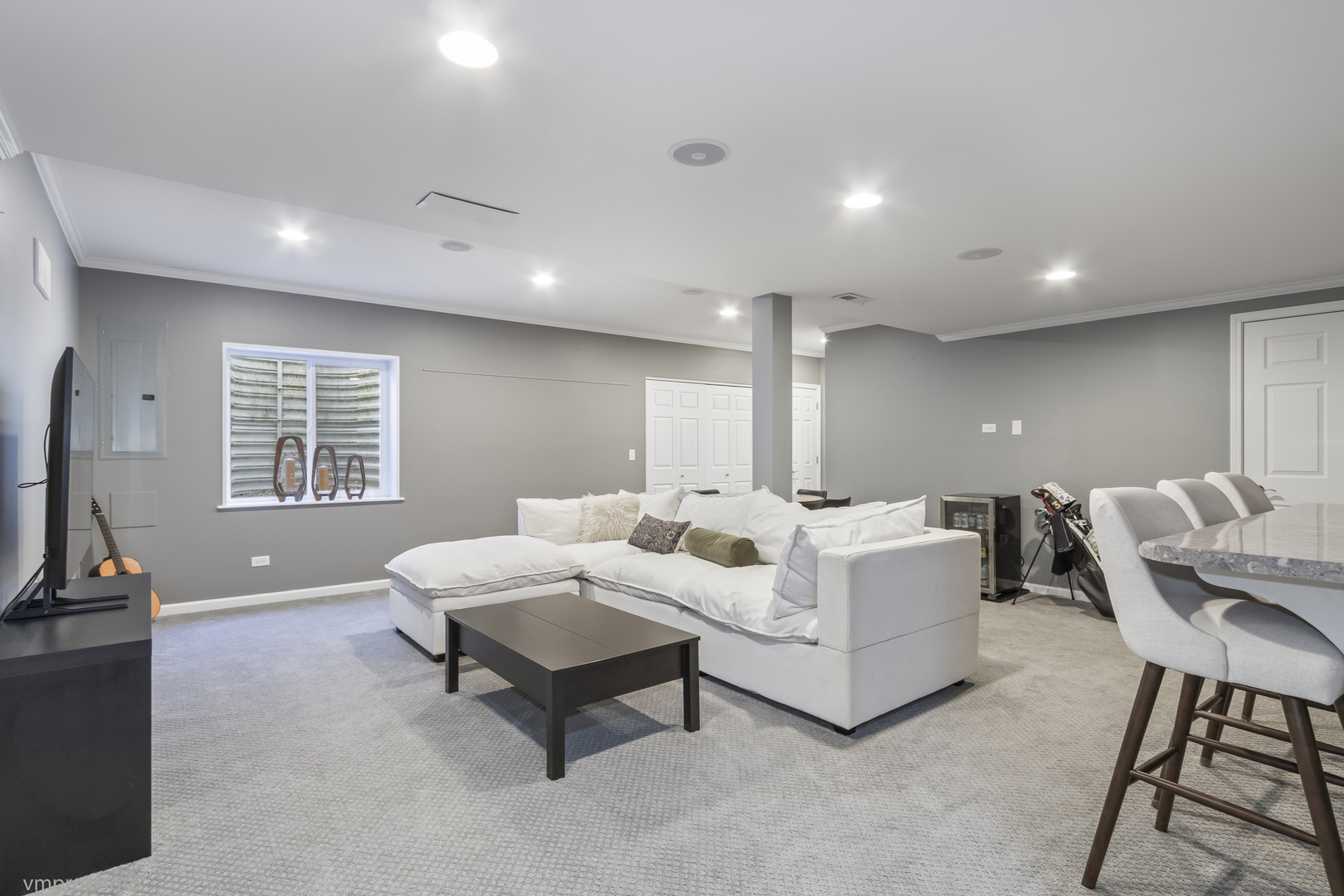 28 East Moseley Road Palatine, IL 60074 - Photo 16 of 25 a living room with furniture a flat screen tv and a window