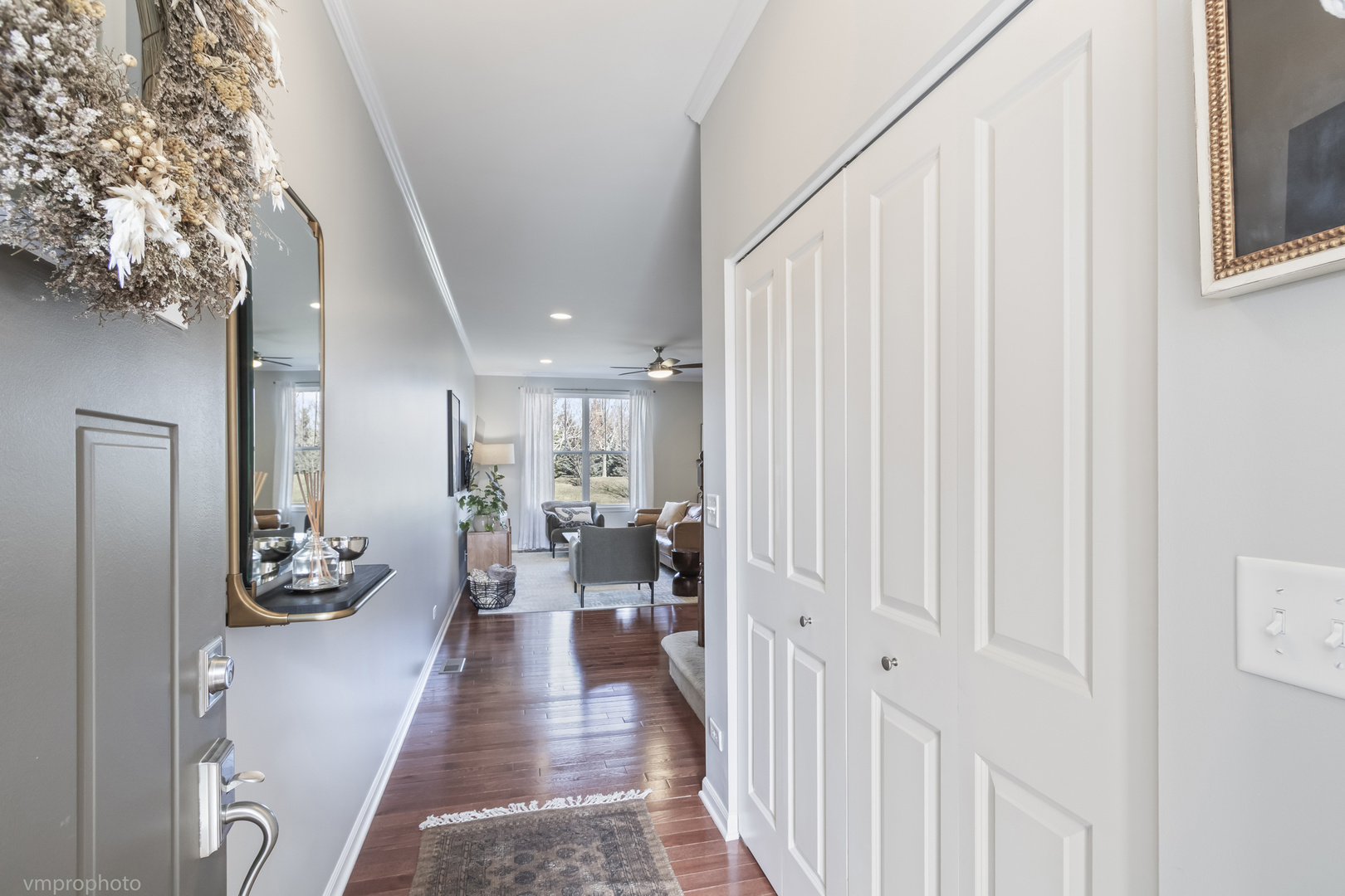 28 East Moseley Road Palatine, IL 60074 - Photo 2 of 25 a hallway with a large window and furniture