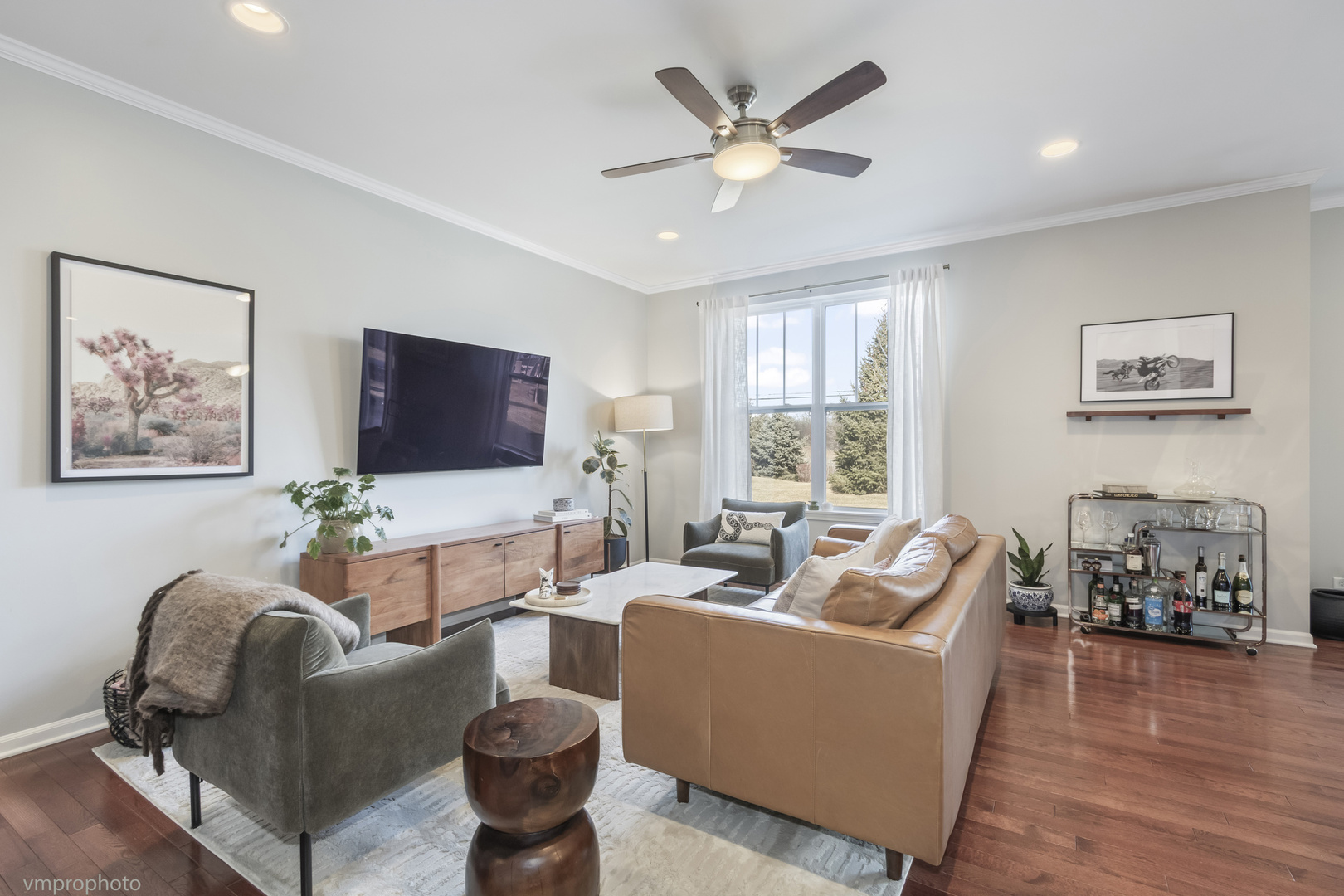 28 East Moseley Road Palatine, IL 60074 - Photo 4 of 25 a living room with furniture a flat screen tv and a window