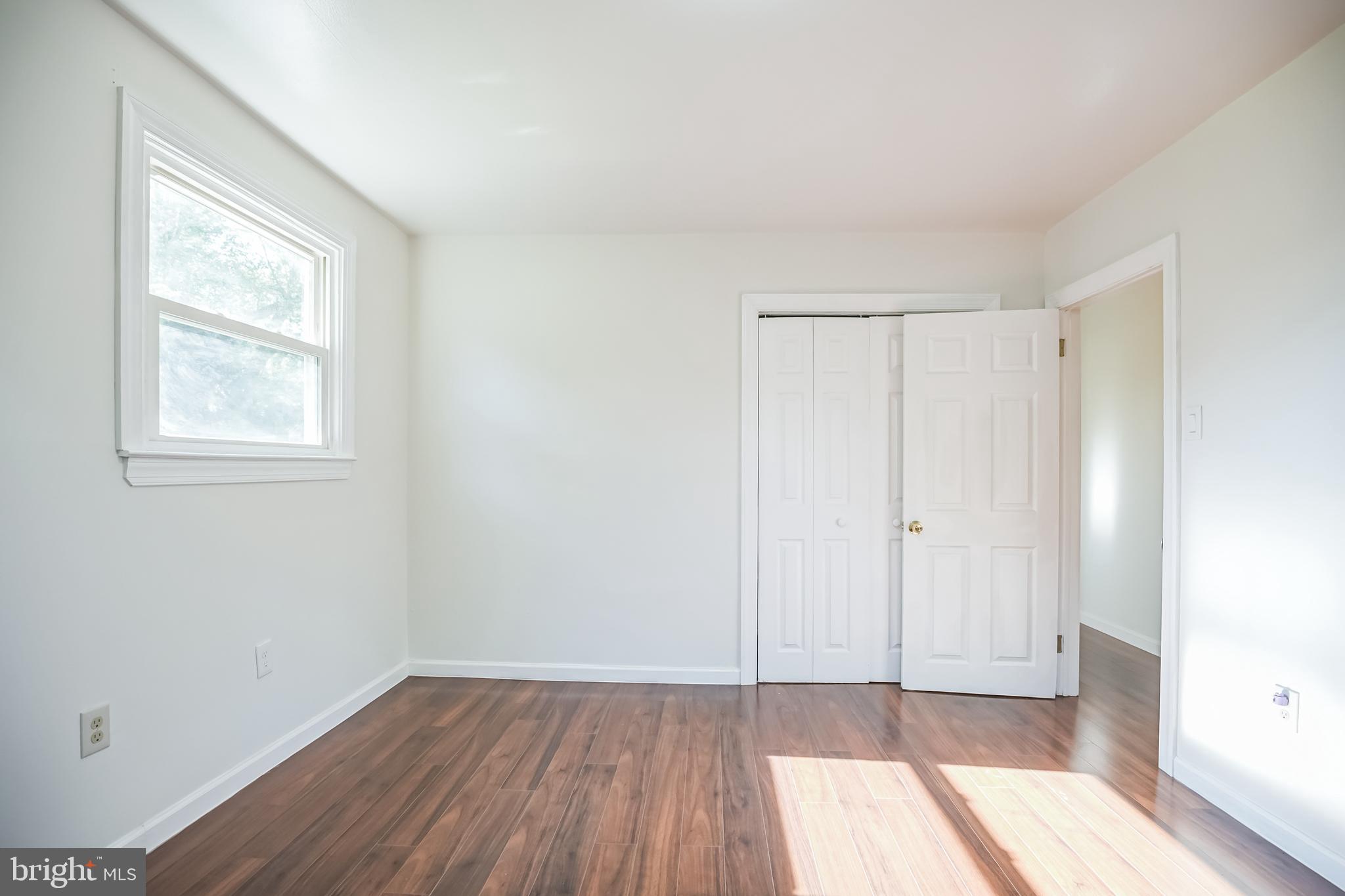 161 New Freedom Road Berlin, NJ 08009 - Photo 16 of 31 an empty room with wooden floor and windows