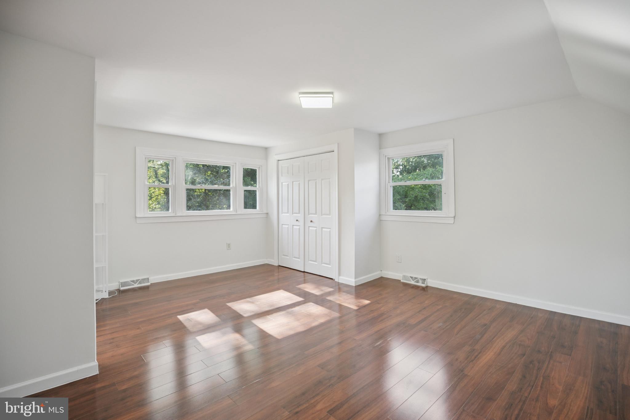 161 New Freedom Road Berlin, NJ 08009 - Photo 18 of 31 an empty room with wooden floor and windows