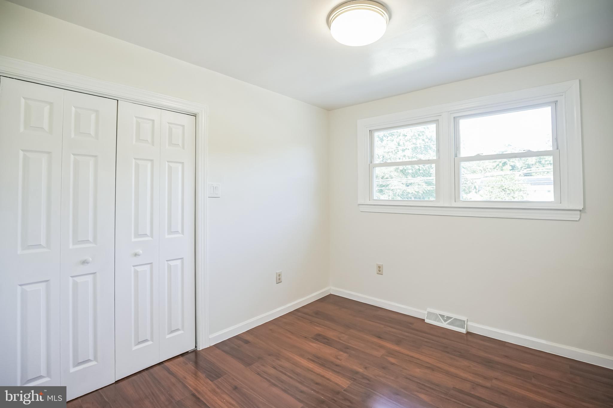 161 New Freedom Road Berlin, NJ 08009 - Photo 21 of 31 an empty room with wooden floor and windows