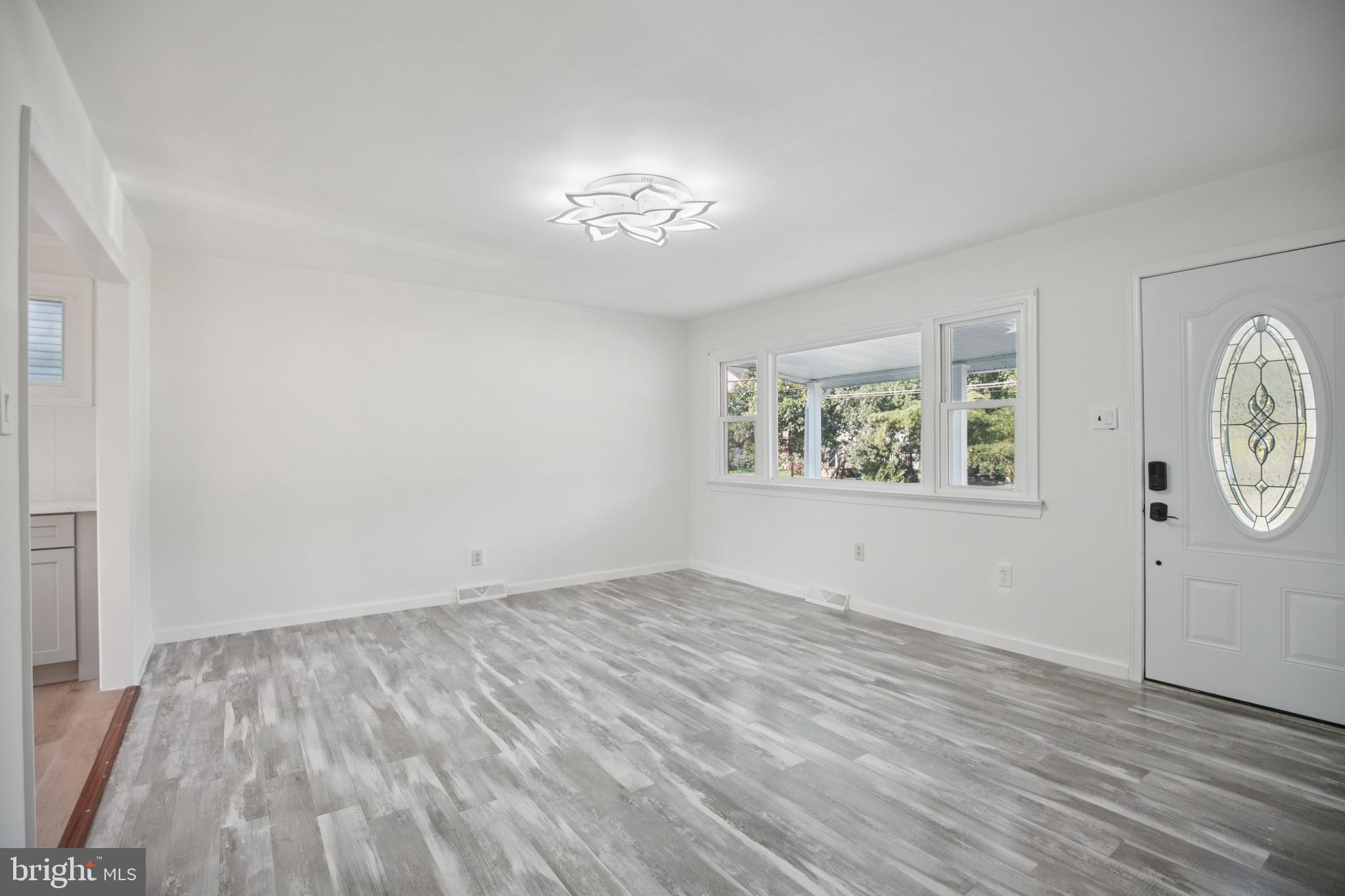 161 New Freedom Road Berlin, NJ 08009 - Photo 5 of 31 a view of an empty room with window and wooden floor
