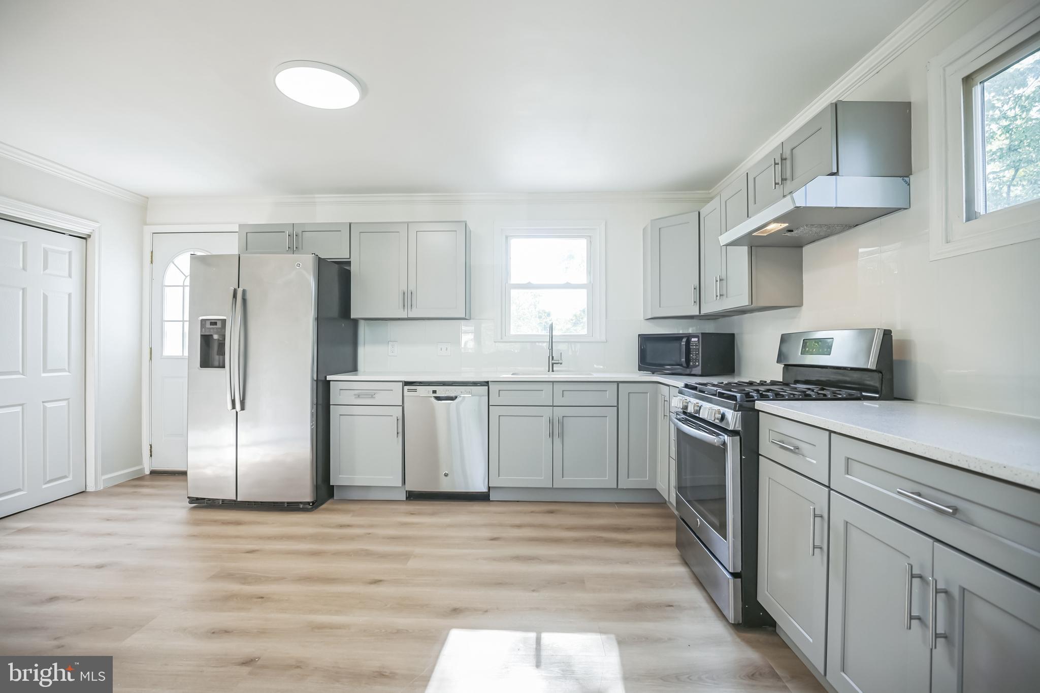 161 New Freedom Road Berlin, NJ 08009 - Photo 6 of 31 a kitchen with stainless steel appliances a refrigerator stove and sink