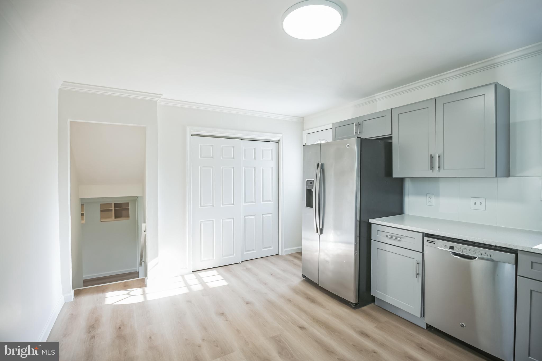 161 New Freedom Road Berlin, NJ 08009 - Photo 8 of 31 a view of a kitchen with wooden floor and electronic appliances