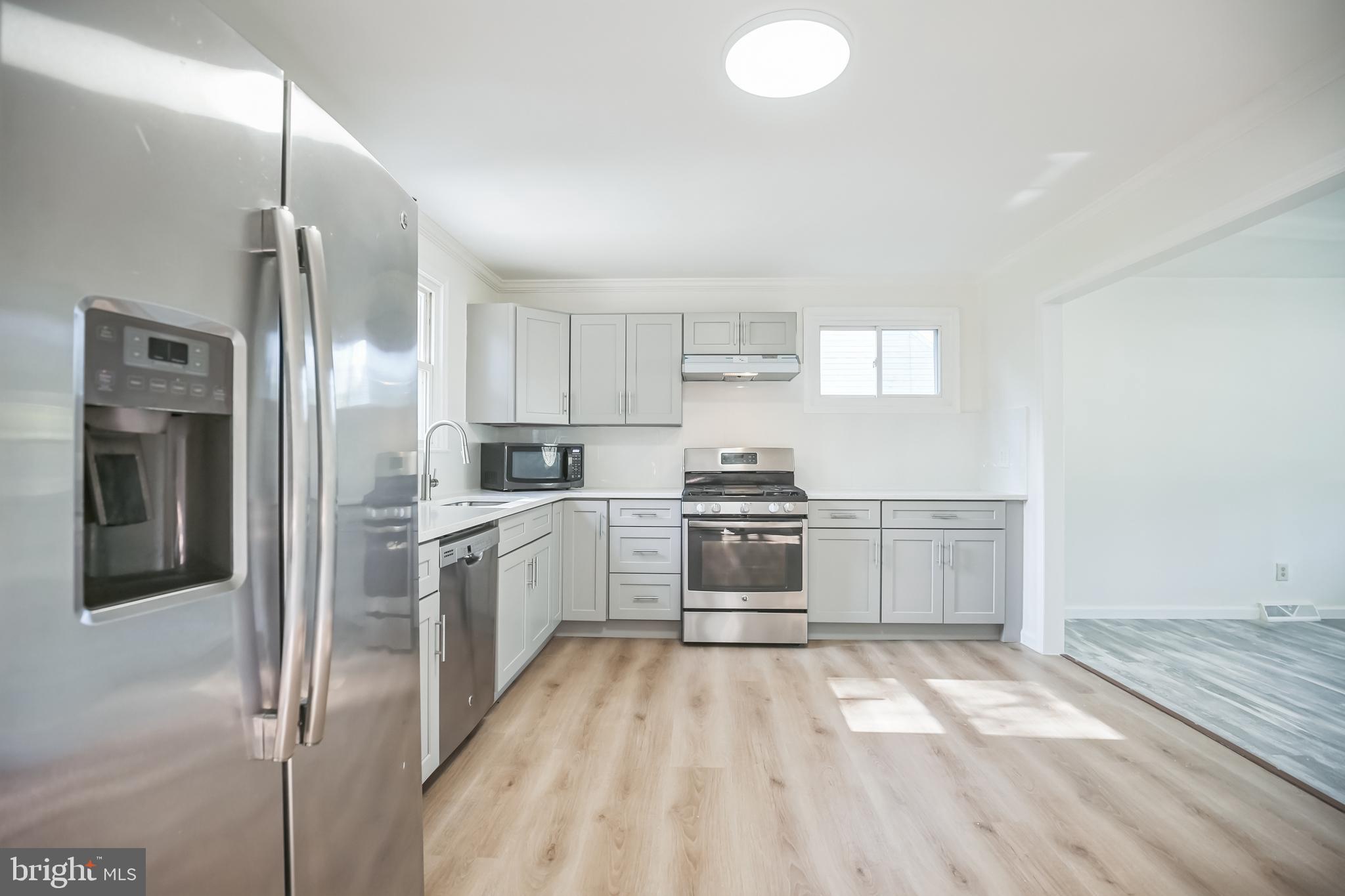 161 New Freedom Road Berlin, NJ 08009 - Photo 9 of 31 a kitchen with granite countertop a refrigerator and a stove top oven