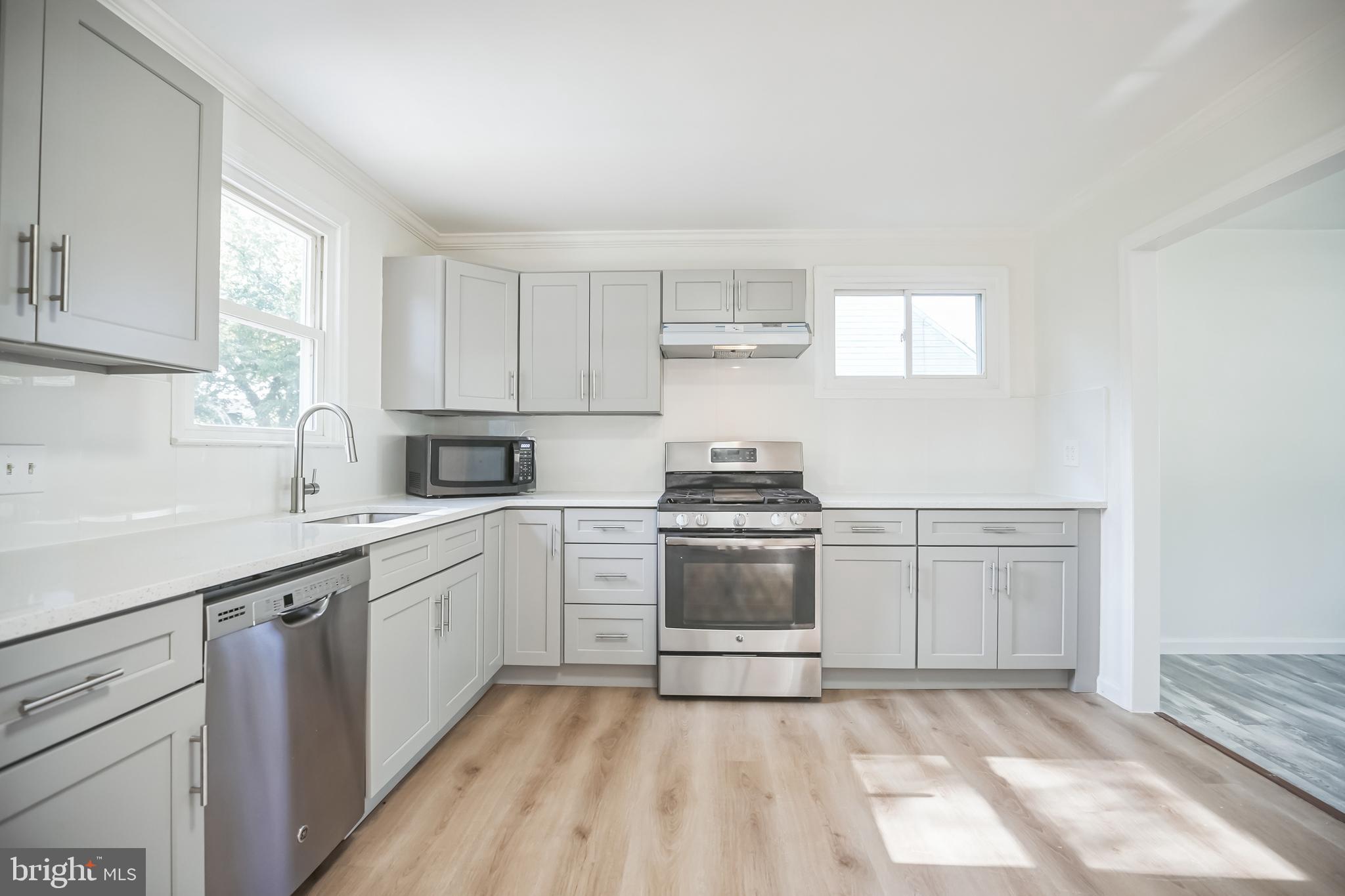 161 New Freedom Road Berlin, NJ 08009 - Photo 10 of 31 a kitchen with a stove oven and sink