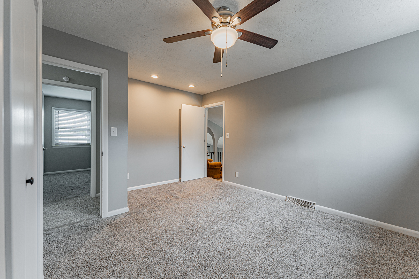 805 South Grove Street Normal, IL 61761 - Photo 20 of 32 an empty room with fan and entrance