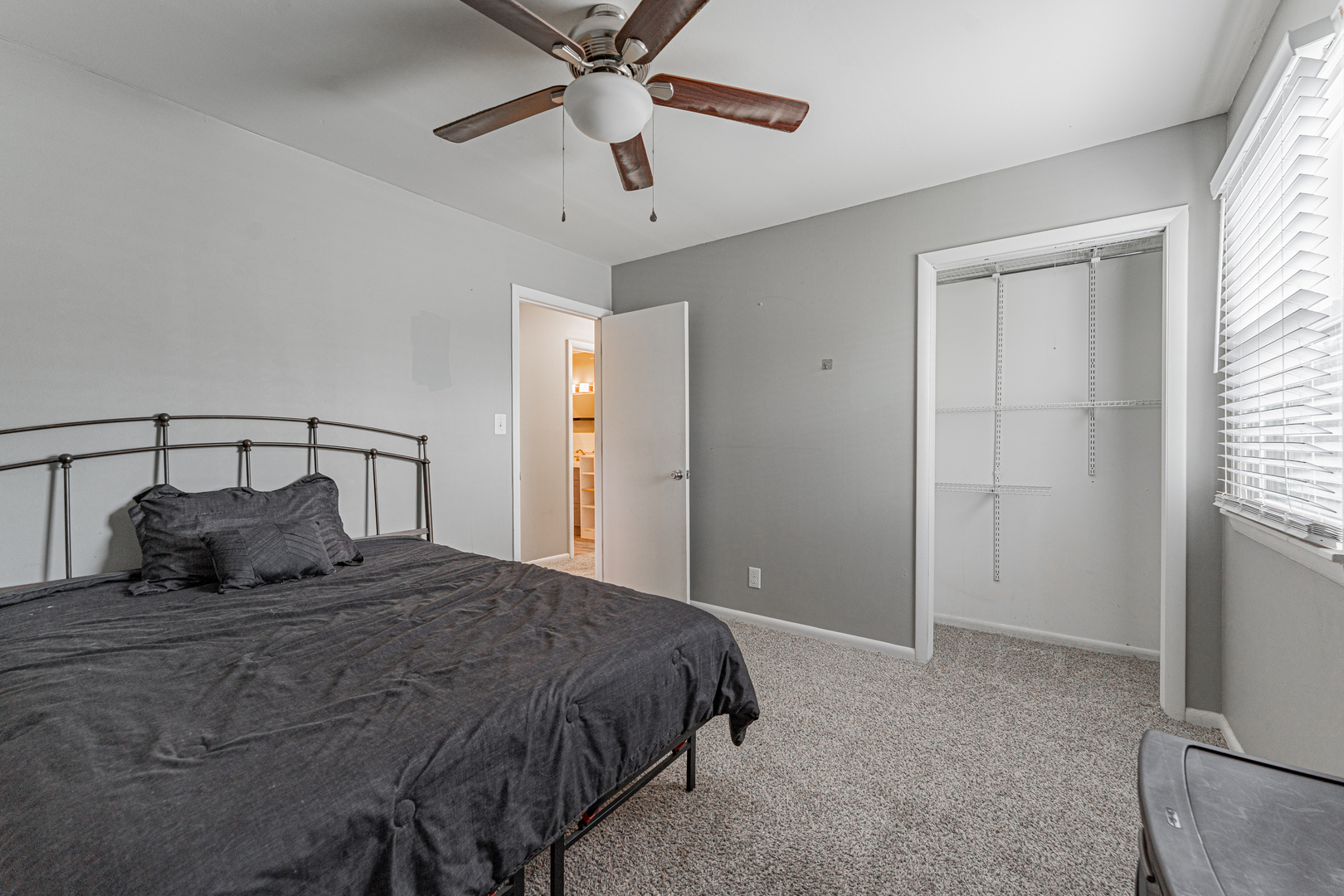 805 South Grove Street Normal, IL 61761 - Photo 25 of 32 a bedroom with a large bed and a chandelier
