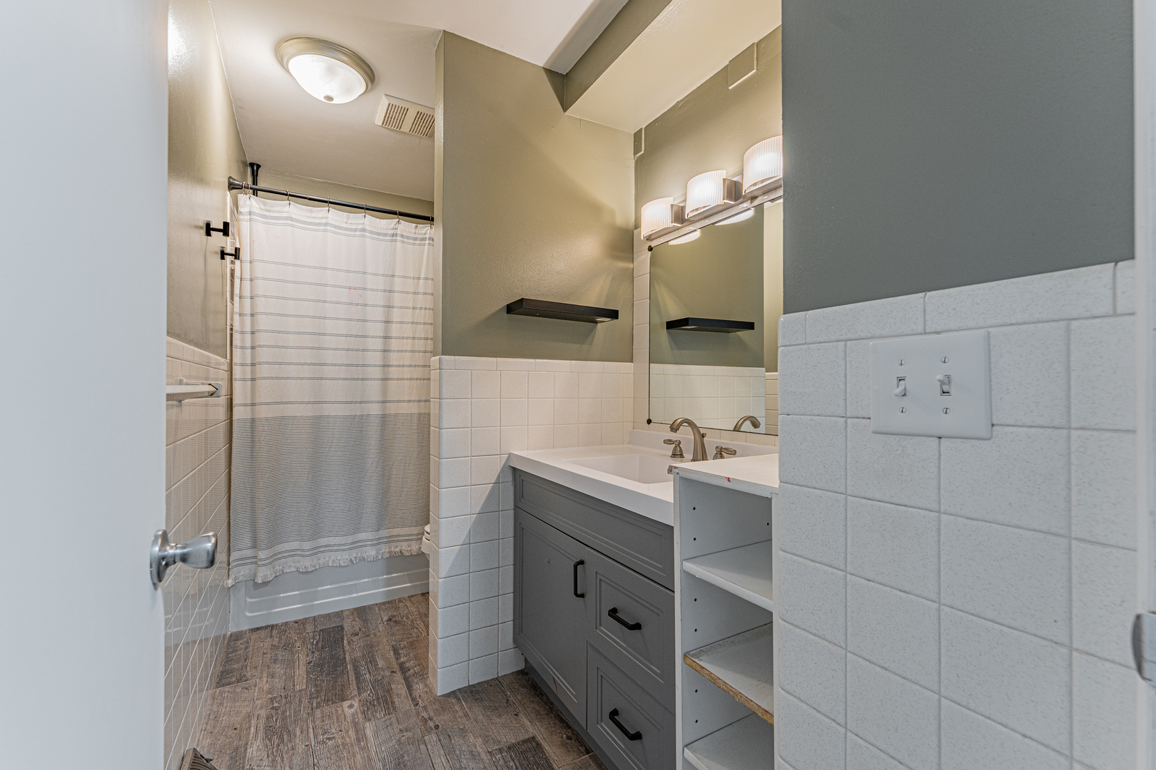 805 South Grove Street Normal, IL 61761 - Photo 26 of 32 a bathroom with a double vanity sink a toilet and a mirror