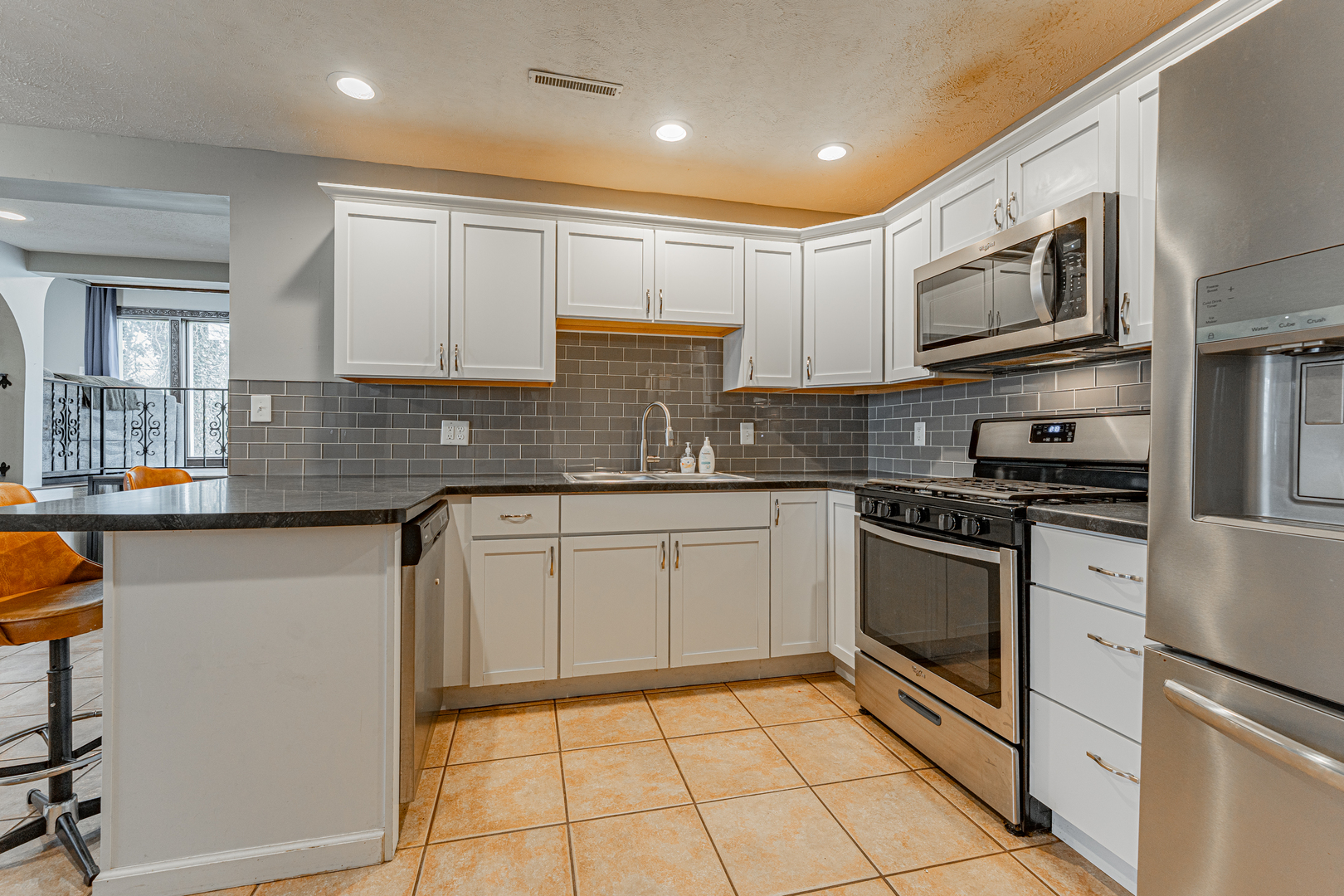 805 South Grove Street Normal, IL 61761 - Photo 7 of 32 a kitchen with stainless steel appliances granite countertop a stove a sink and a microwave