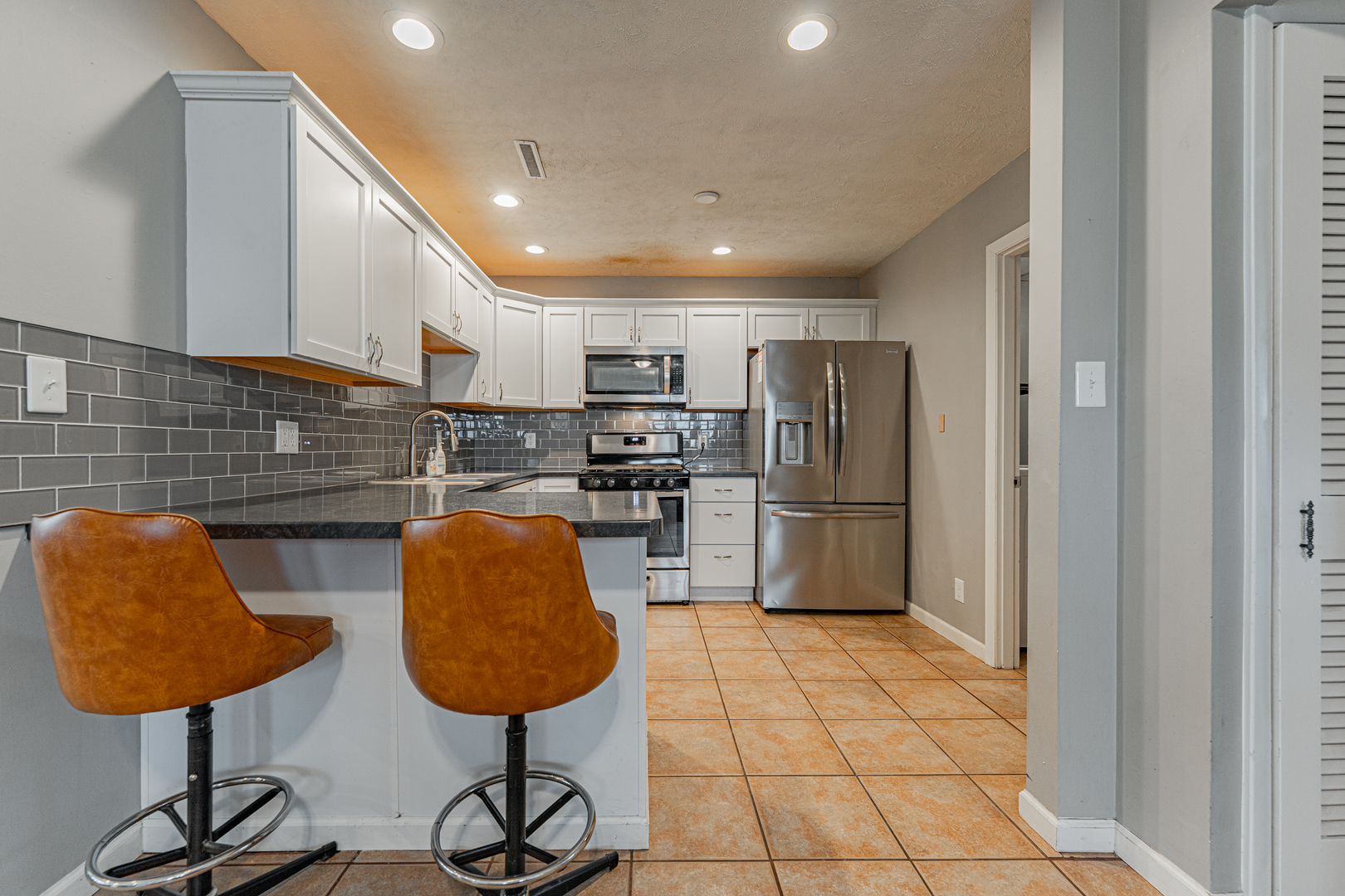 805 South Grove Street Normal, IL 61761 - Photo 8 of 32 a kitchen with stainless steel appliances granite countertop a refrigerator and a sink