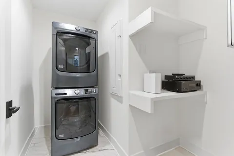 a spacious bathroom with a granite countertop sink mirror and a shower