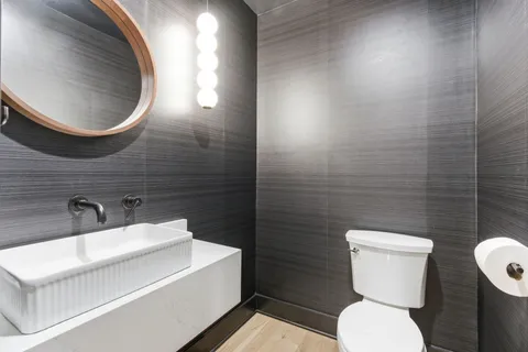 a bathroom with a bathtub and toilet