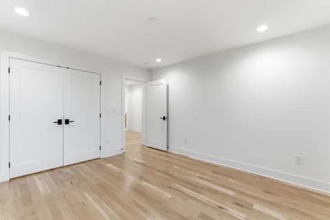 a view of a balcony with wooden floor