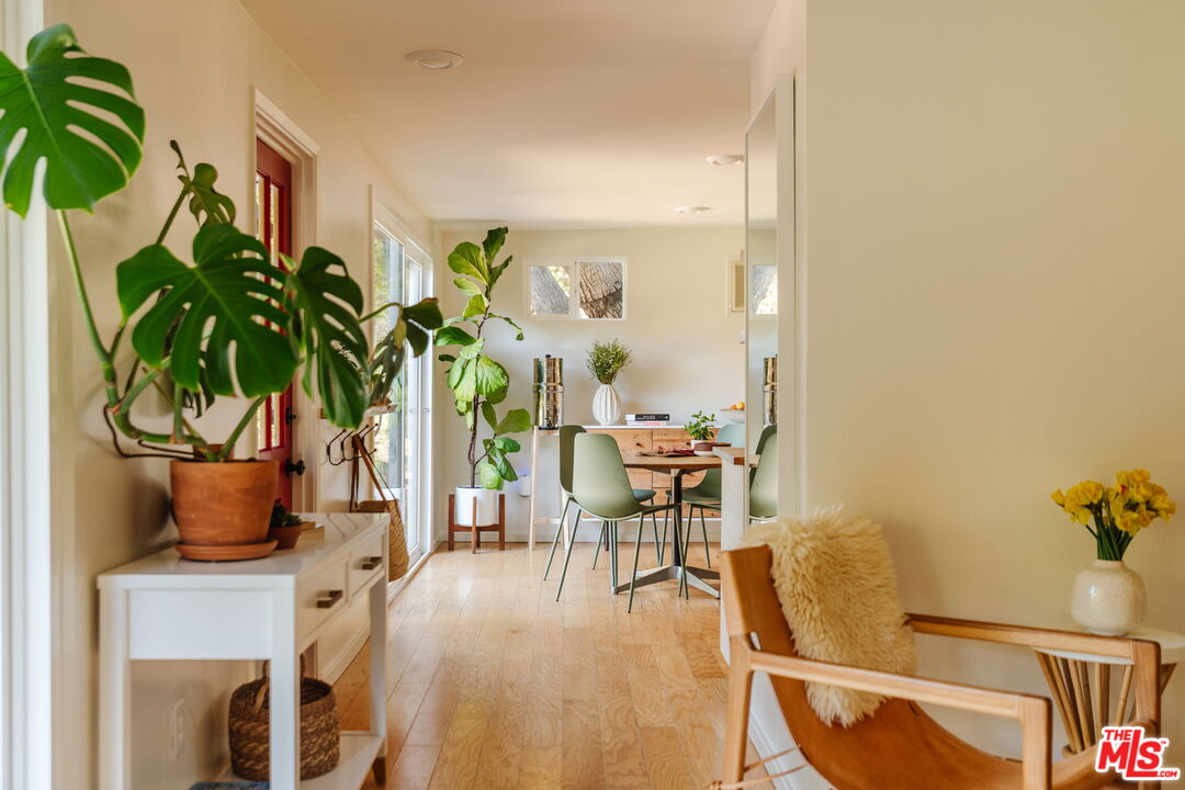 20906 Fontaine Road Topanga, CA 90290 - Photo 14 of 73 a living room with furniture and a potted plant