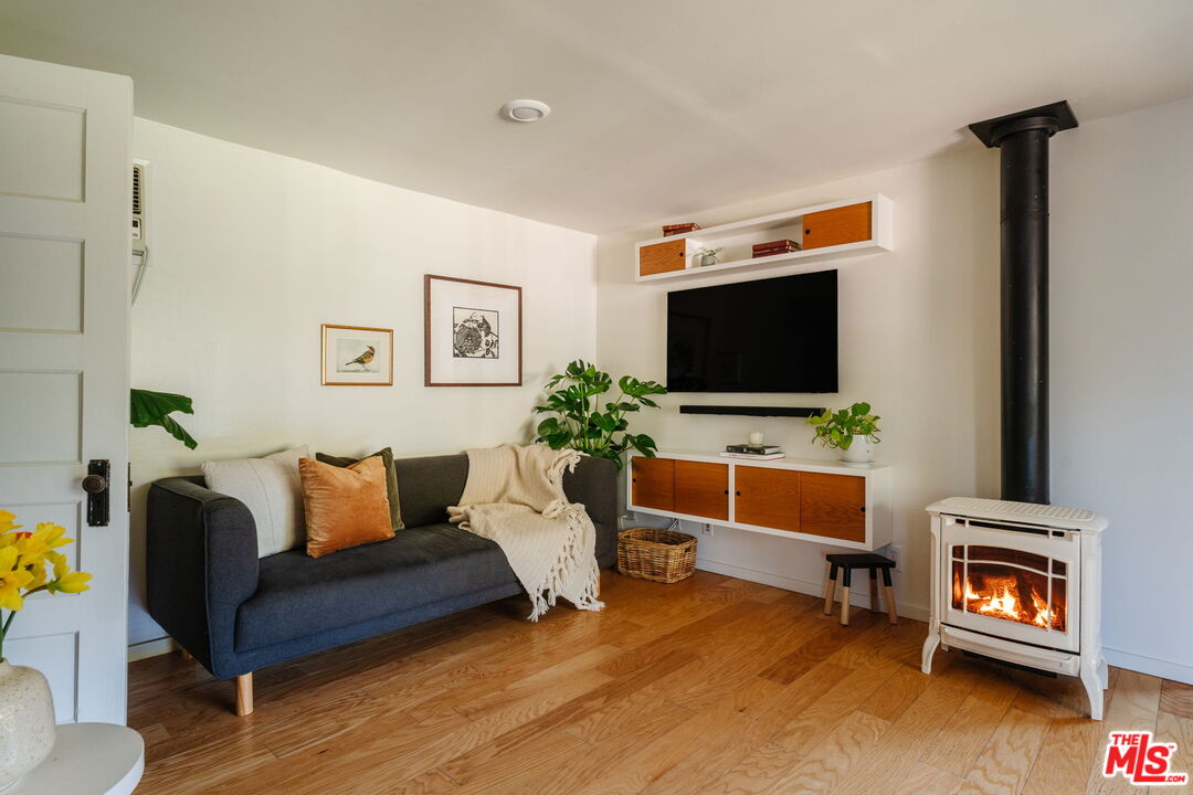 20906 Fontaine Road Topanga, CA 90290 - Photo 15 of 73 a living room with furniture and a flat screen tv