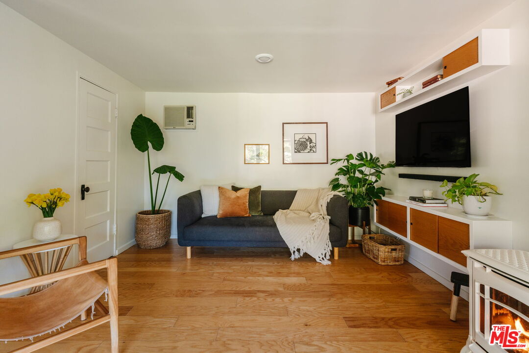 20906 Fontaine Road Topanga, CA 90290 - Photo 18 of 73 a living room with furniture and a flat screen tv