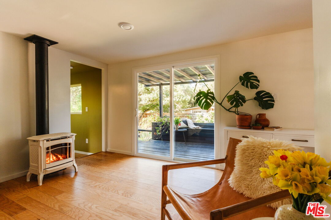 20906 Fontaine Road Topanga, CA 90290 - Photo 21 of 73 a living room with furniture and a wooden floor