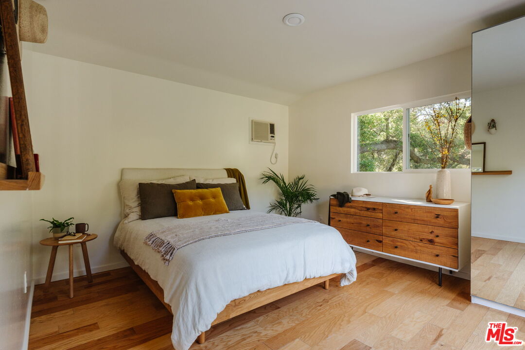 20906 Fontaine Road Topanga, CA 90290 - Photo 27 of 73 a bedroom with a bed and a dresser