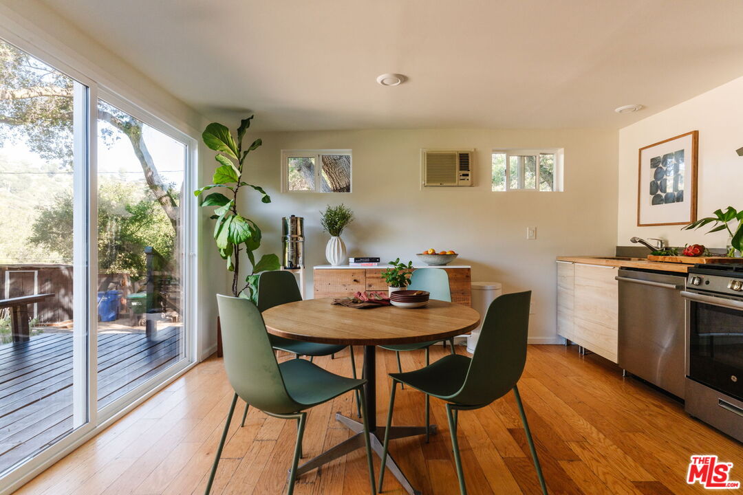 20906 Fontaine Road Topanga, CA 90290 - Photo 4 of 73 a view of a dining room with furniture window and wooden floor