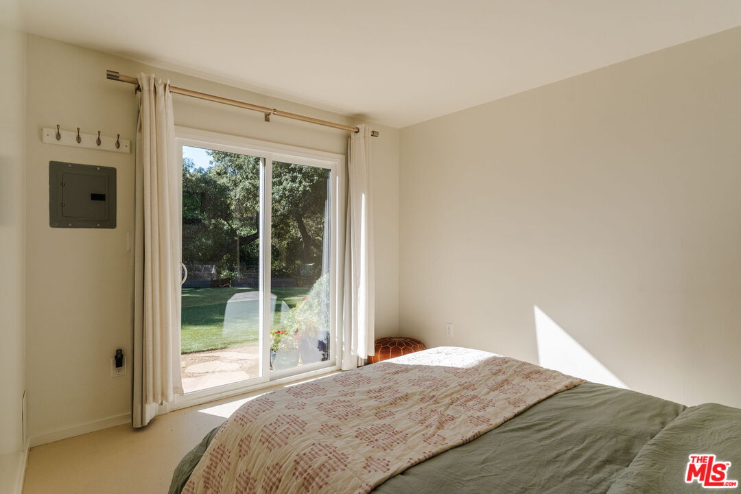 20906 Fontaine Road Topanga, CA 90290 - Photo 54 of 73 a bedroom with a bed and a window