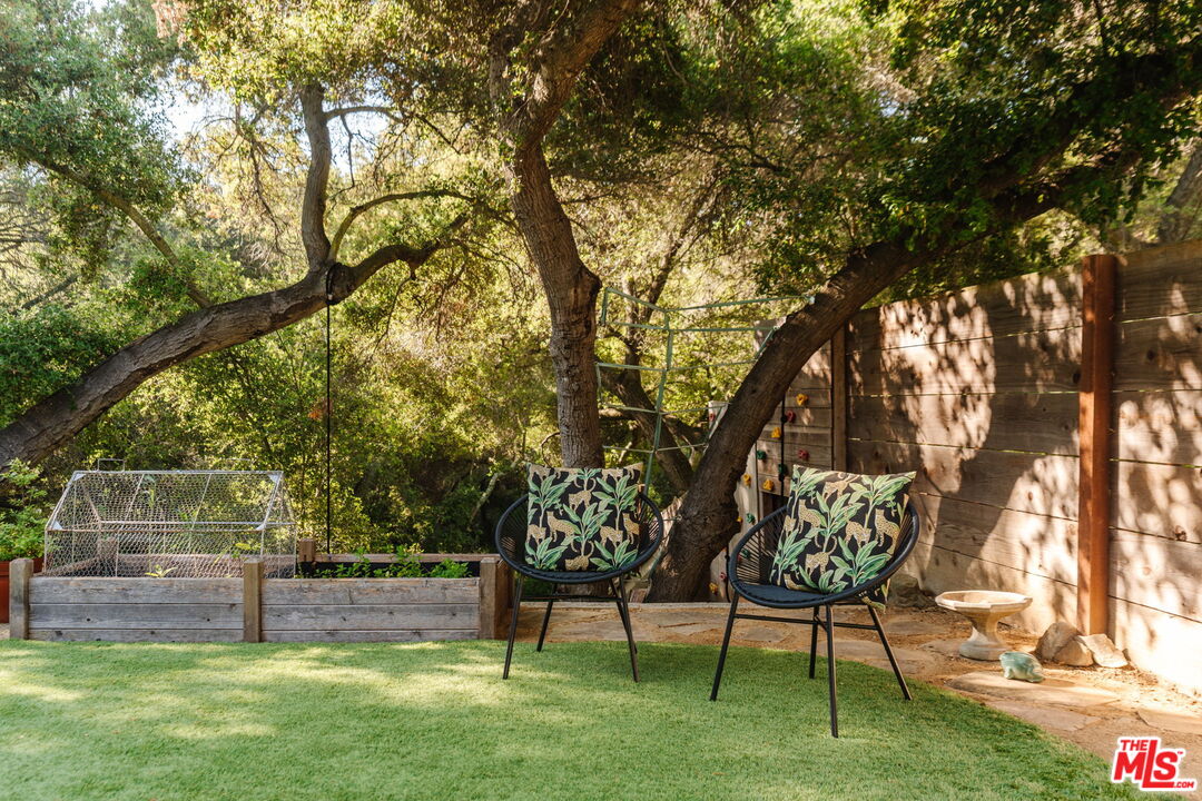 20906 Fontaine Road Topanga, CA 90290 - Photo 68 of 73 a view of yard with a table and a chairs
