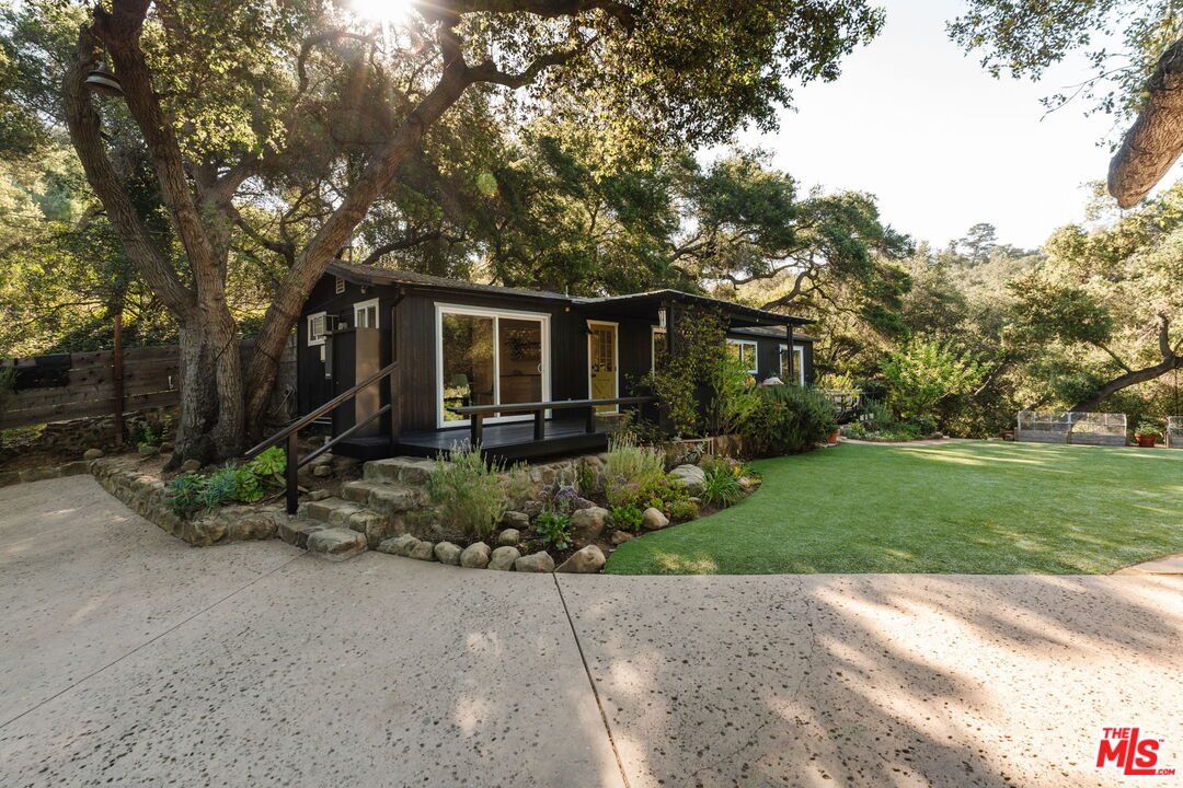 20906 Fontaine Road Topanga, CA 90290 - Photo 69 of 73 a front view of house with yard and green space