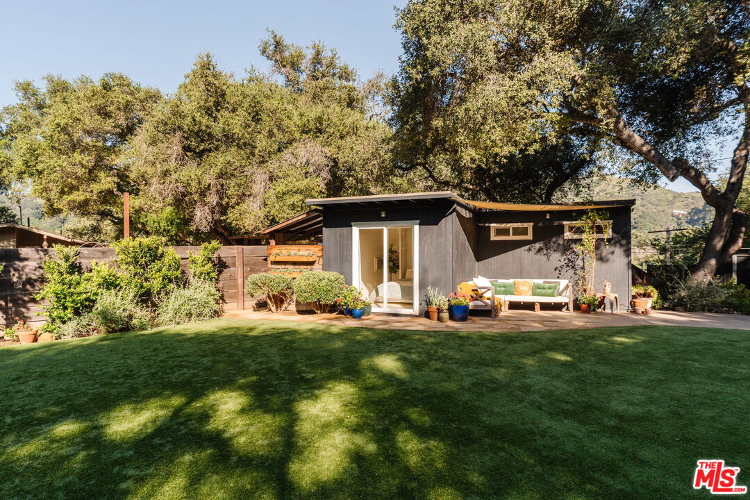 20906 Fontaine Road Topanga, CA 90290 - Photo 71 of 73 a front view of a house with a garden