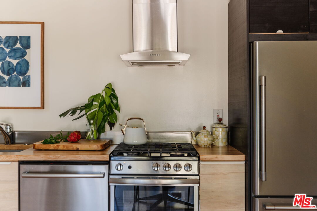 20906 Fontaine Road Topanga, CA 90290 - Photo 9 of 73 a stove top oven sitting inside of a kitchen