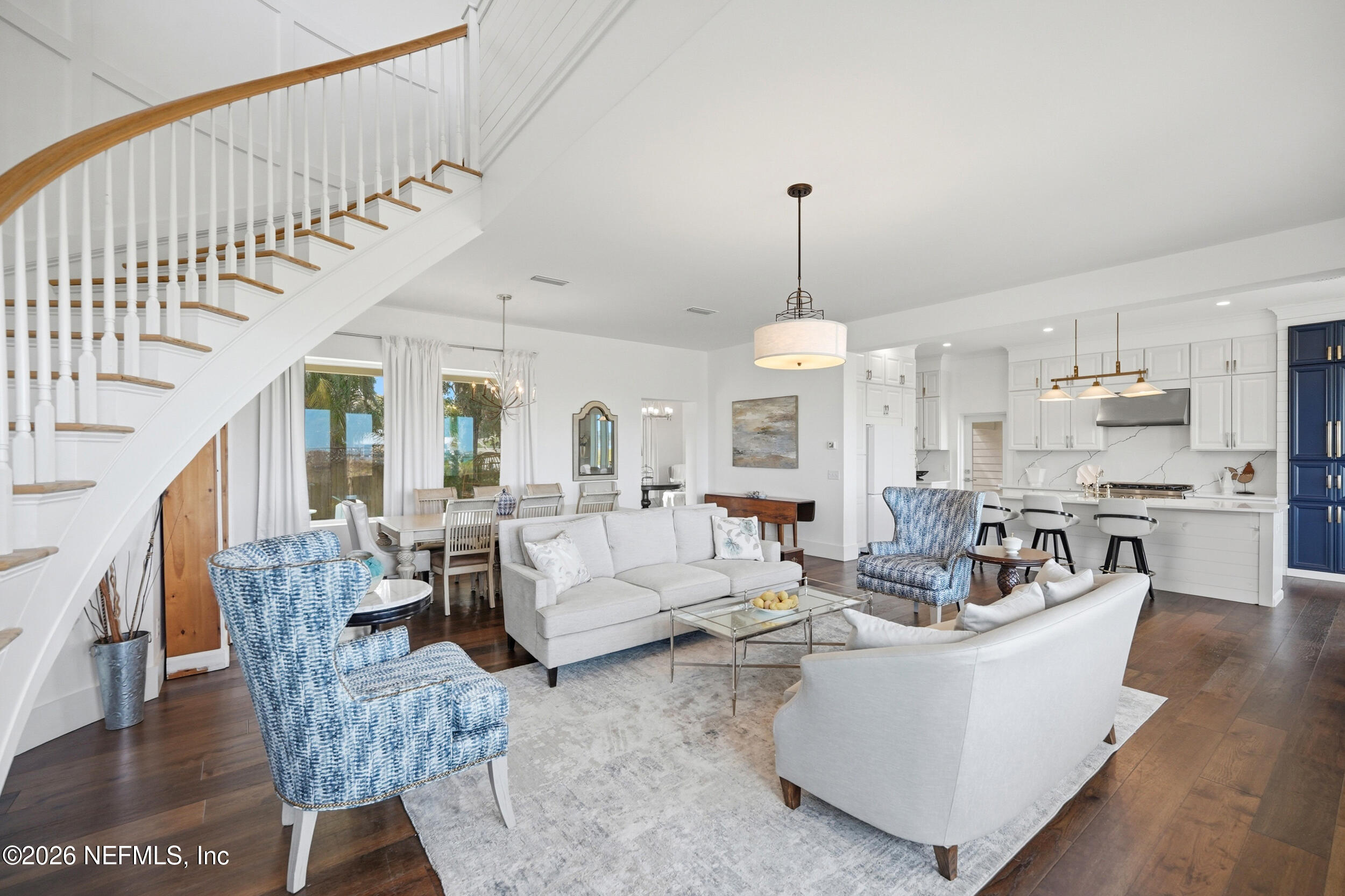 2406 Shore Drive St. Augustine, FL 32086 - Photo 12 of 108 a living room with furniture and a chandelier