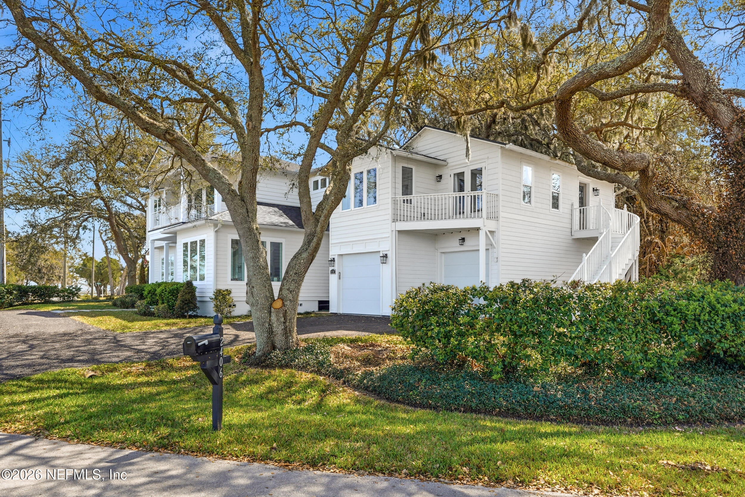 2406 Shore Drive St. Augustine, FL 32086 - Photo 2 of 108 a front view of a house with garden