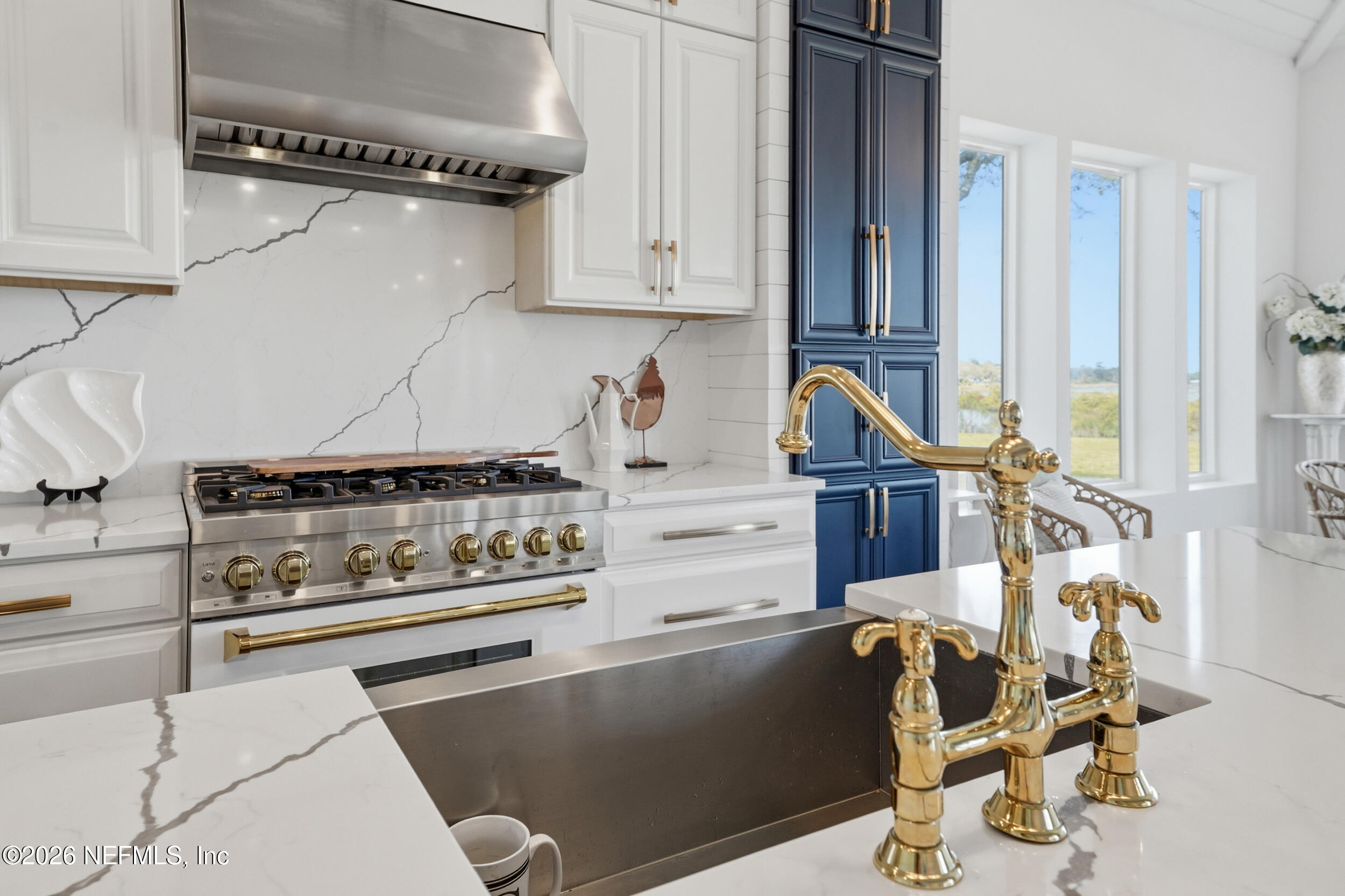 2406 Shore Drive St. Augustine, FL 32086 - Photo 25 of 108 a kitchen with appliances and cabinets