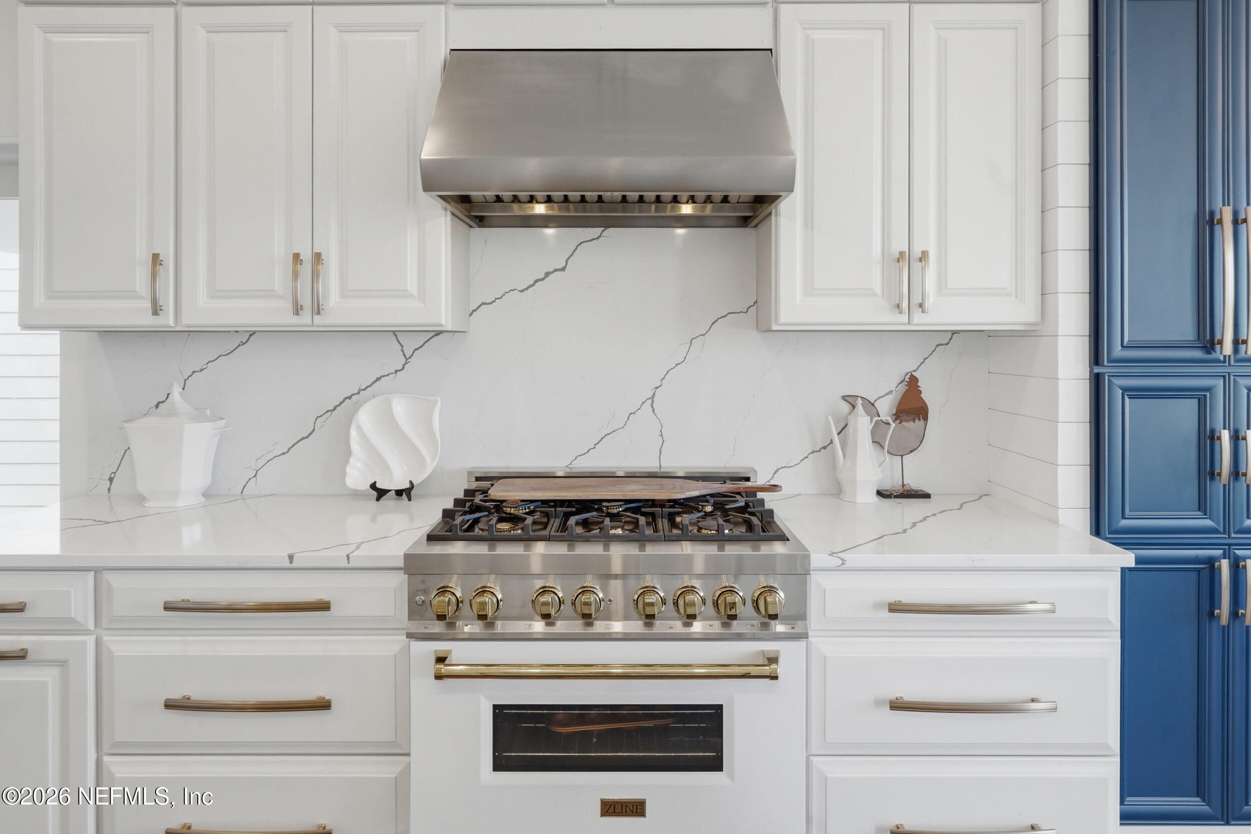 2406 Shore Drive St. Augustine, FL 32086 - Photo 26 of 108 a stove top oven sitting inside of a kitchen