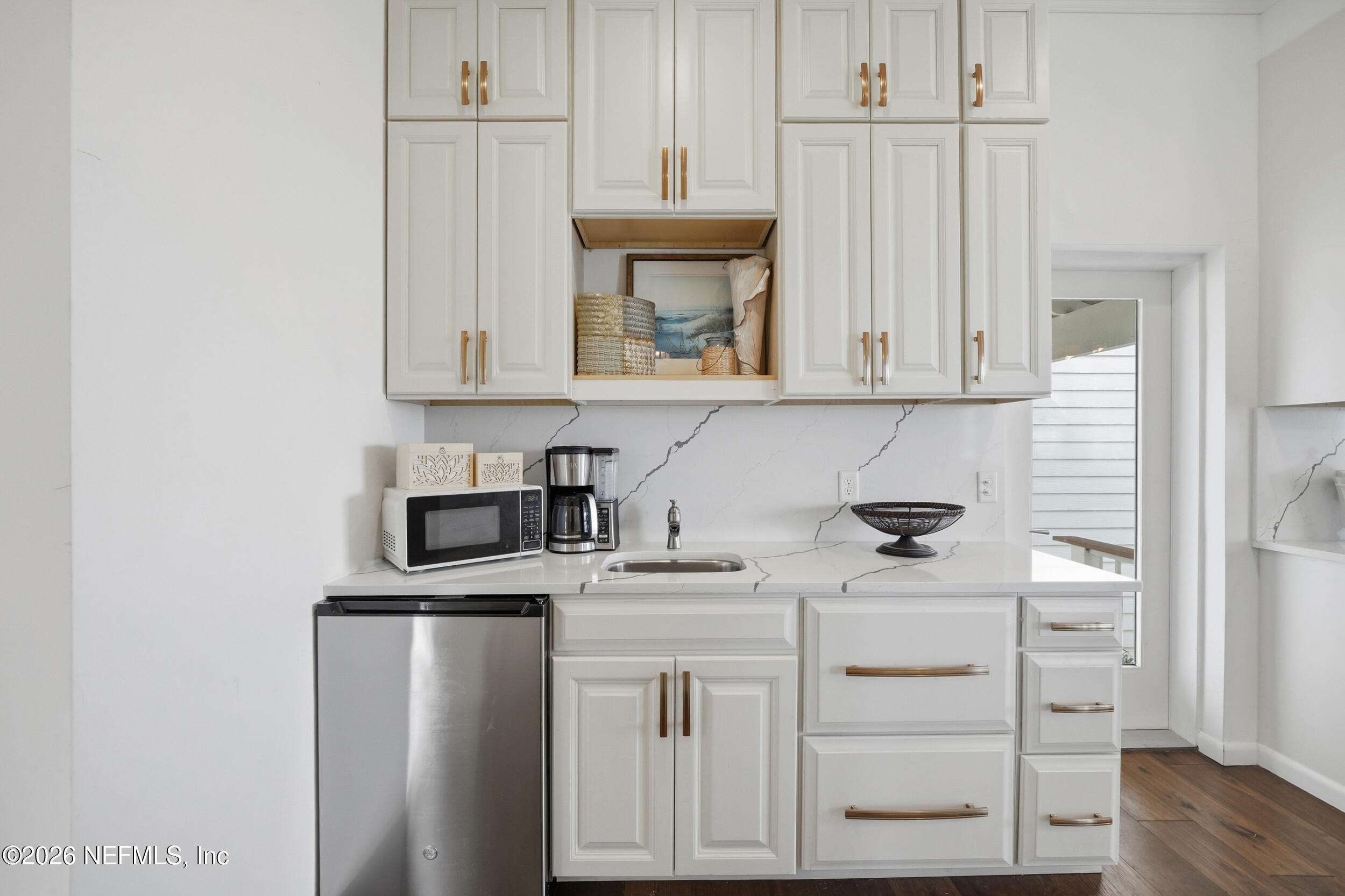2406 Shore Drive St. Augustine, FL 32086 - Photo 28 of 108 a kitchen with stainless steel appliances a stove microwave and refrigerator