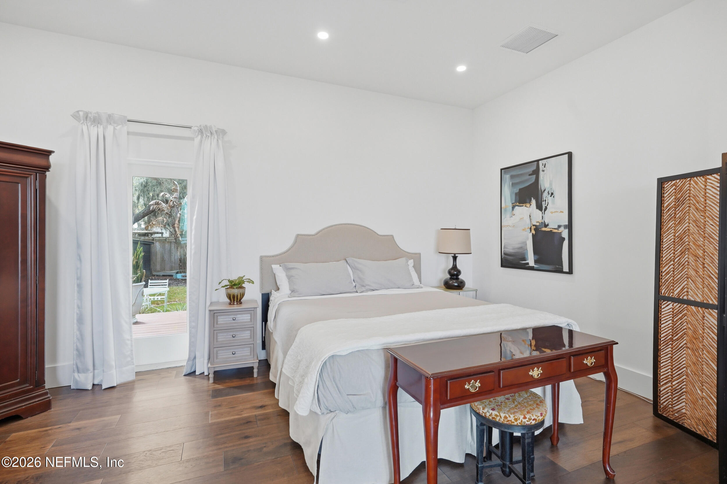 2406 Shore Drive St. Augustine, FL 32086 - Photo 36 of 108 a bedroom with a bed and a table