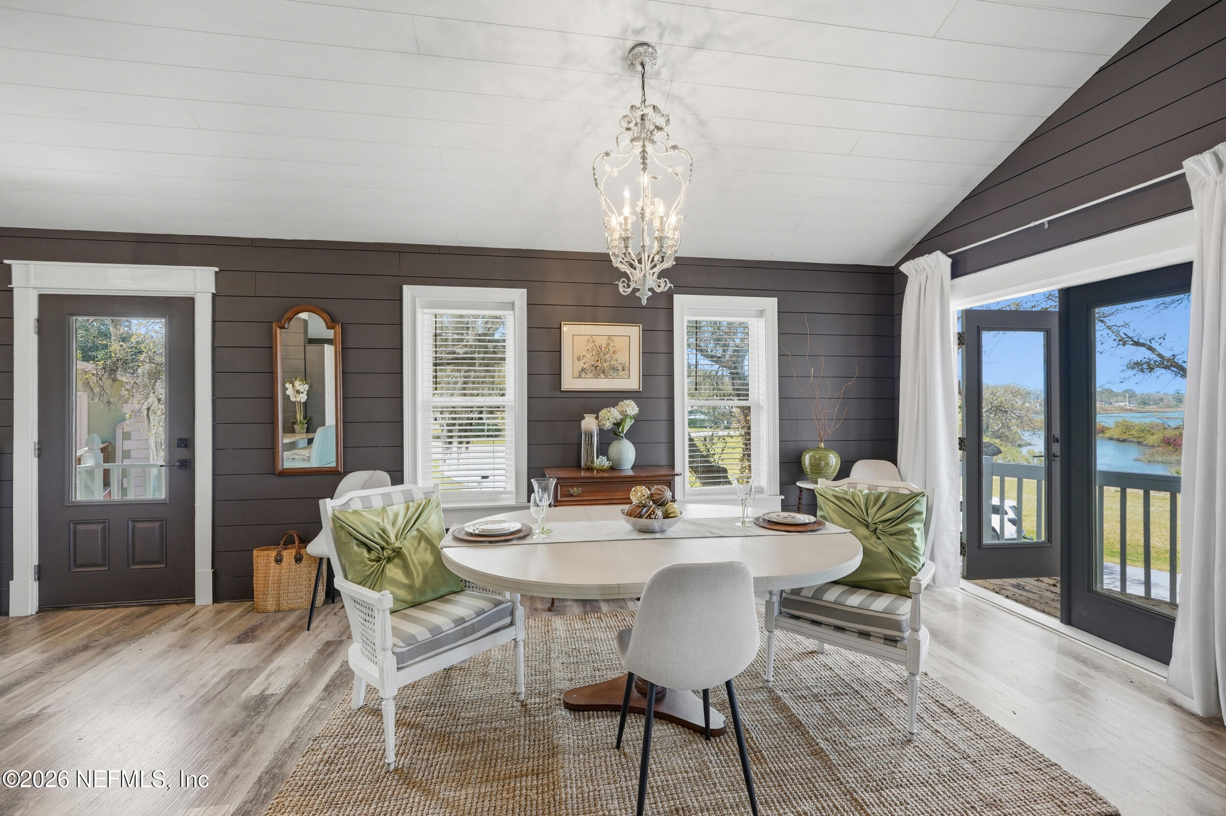 2406 Shore Drive St. Augustine, FL 32086 - Photo 75 of 108 a view of a dining room with furniture wooden floor and chandelier