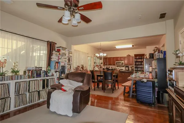 a bedroom with a bed and ceiling fan