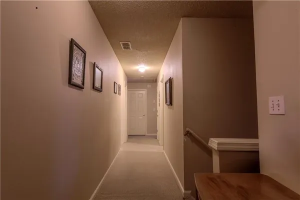 a bedroom with a bed and a large mirror with a chandelier