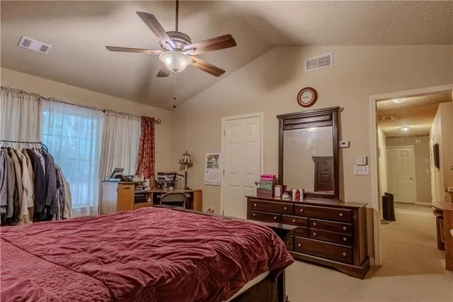 a bathroom with a tub and shower curtain