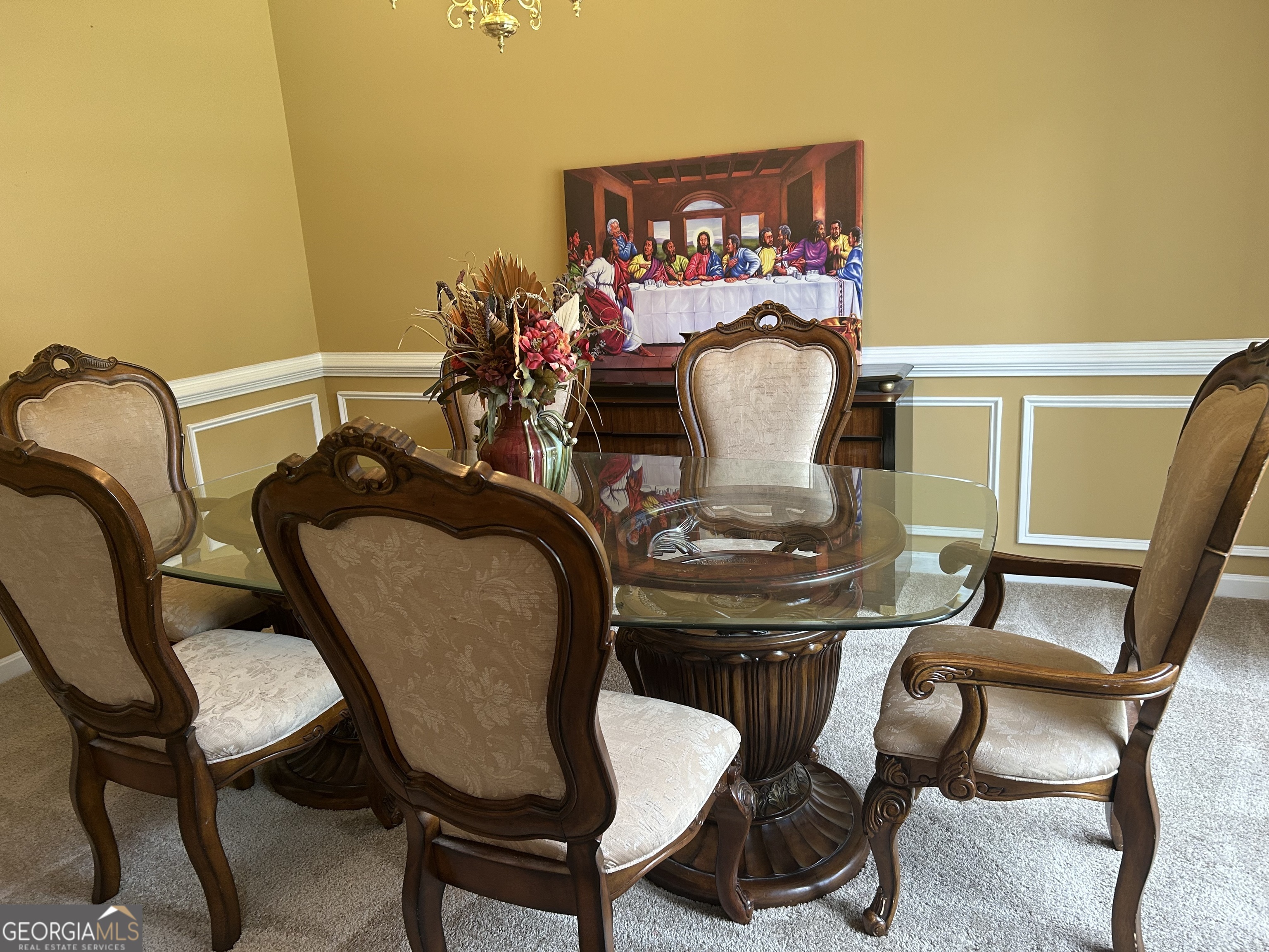1221 Rhodes Walk Southwest Conyers, GA 30094 - Photo 4 of 19 a view of a dining room with furniture and a potted plant