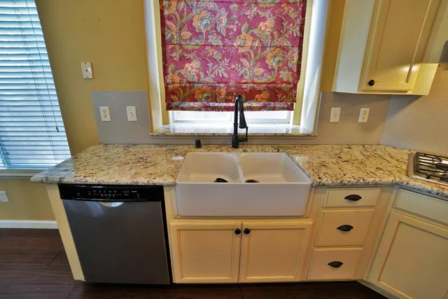 a bathroom with a toilet sink vanity and mirror